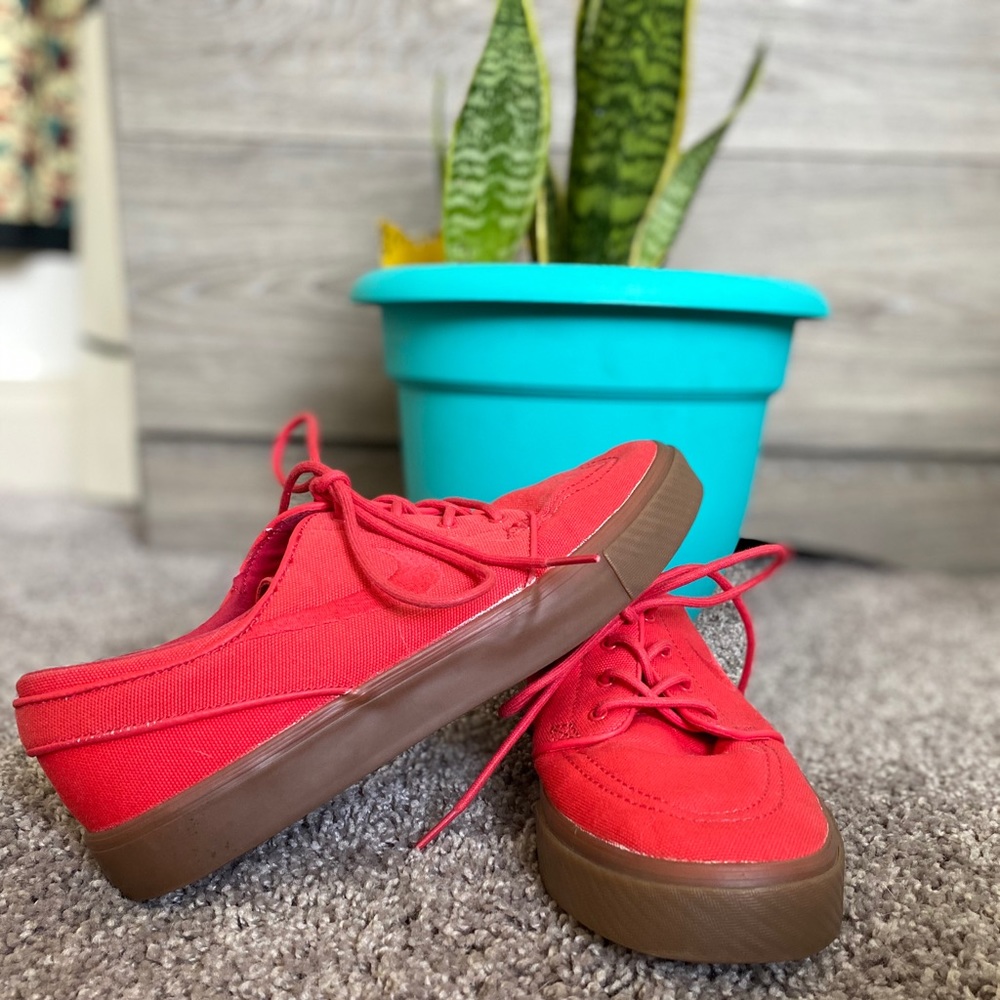 All red Nike canvas style shoe size 9
